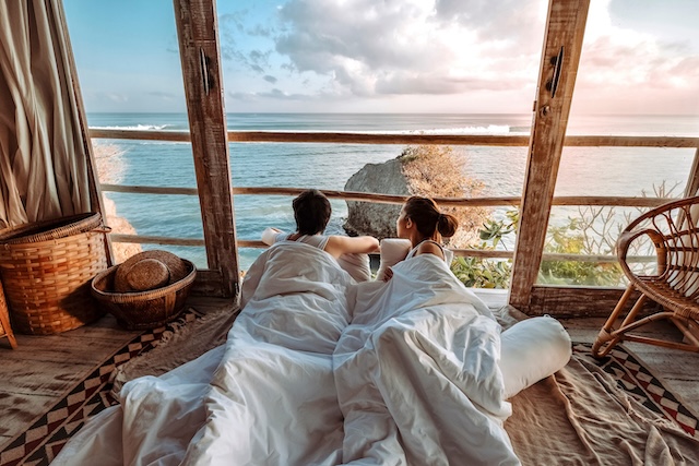 couple,enjoying,morning,vacations,on,tropical,beach,bungalow,looking,ocean couple,enjoying,morning,vacations,on,tropical,beach,bungalow,looking,ocean