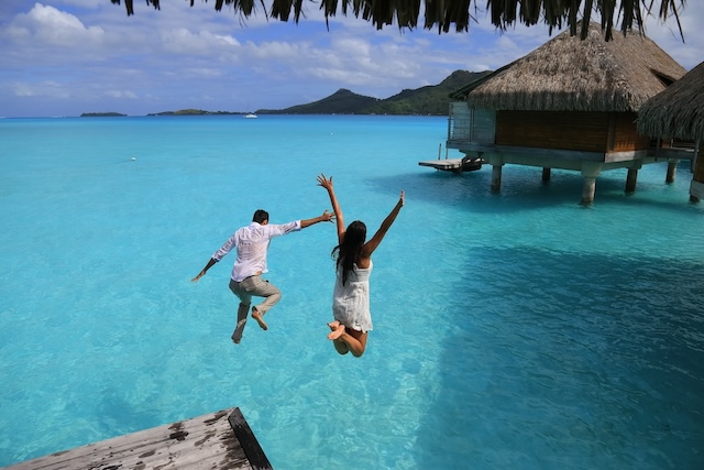 happiness,jump,of,young,couple,on,the,water.,over,water happiness,jump,of,young,couple,on,the,water.,over,water